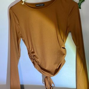 A tan long sleeve shirt
